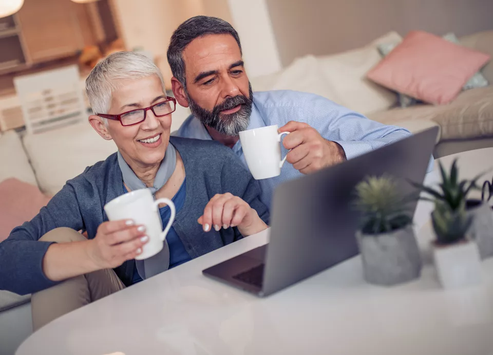 man and woman on laptop